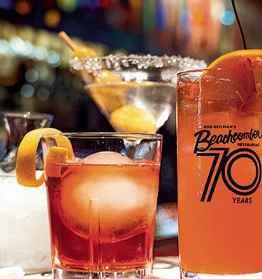 A set of cocktails with oranges on their rims from Beachcomber bar in Clearwater.