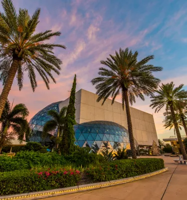 A view of the unique architecture of the Dali Museum at sunset.