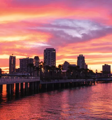 Panoramic view of St. Pete skyline during colorful sunset from the St. Pete Pier