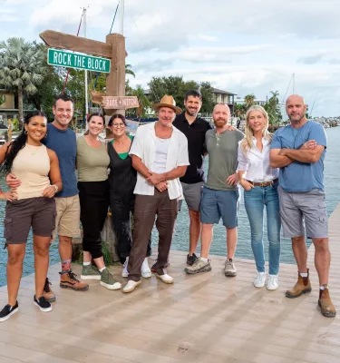 a group of actors from HGTV's Rock the Block show stand on a pier in Treasure Island