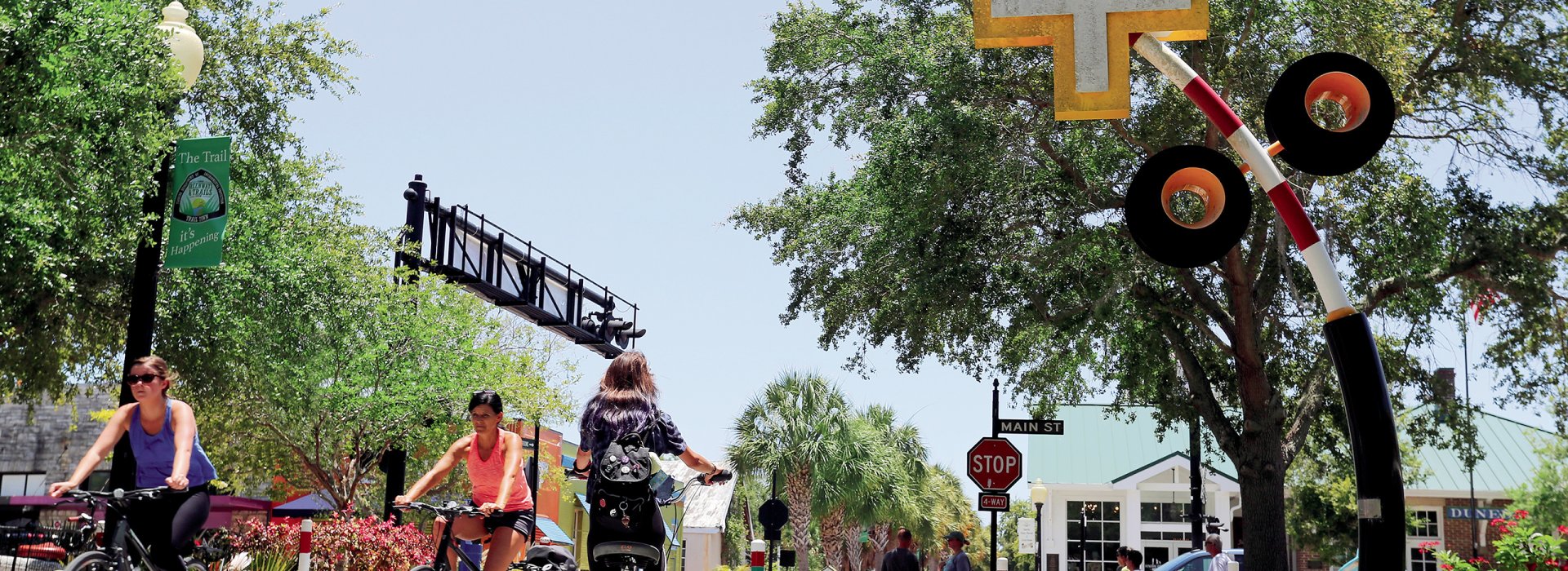 Bikers at Pinellas Trail crossing Dunedin's Main St.