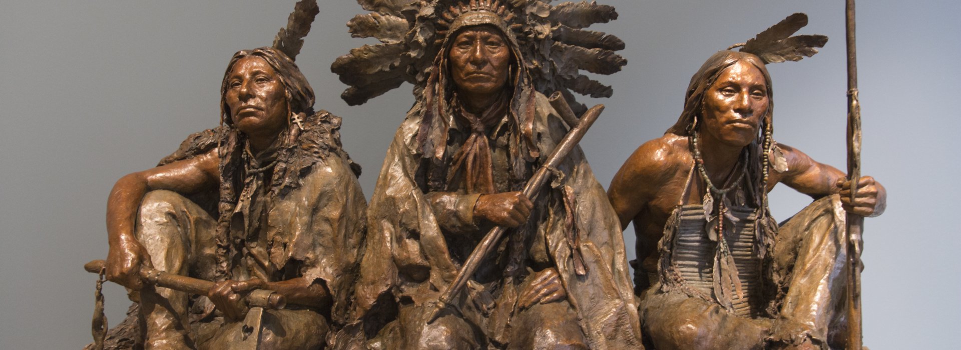 A bronze sculpture of Native American warriors