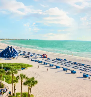 Pool, beach cabanas and a giant water slide at TradeWinds beachfront resort