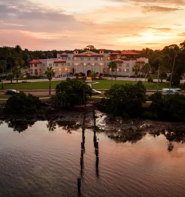 An aerial view of the waterfront at Fenway hotel in Dunedin at sunrise