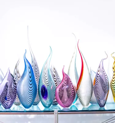 Colorful glass sculpture looking like fire flames at Imagine Museum