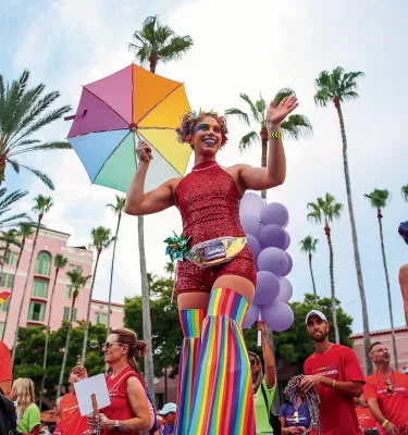 Marchers clad in rainbow clothing pass by the Vinoy during the St. Pete Pride Parade.