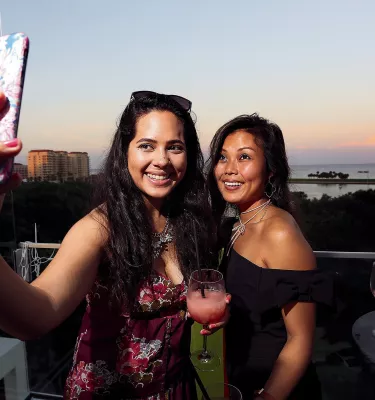 Two woman take a selfie at the Birchwood rooftop