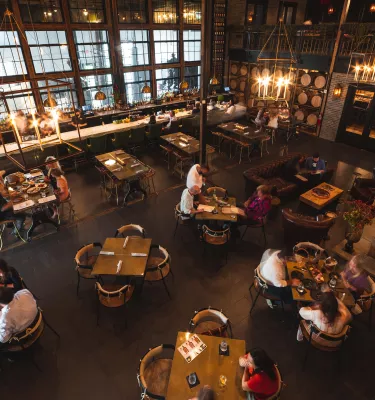 Arial View of a Stillhouse with dining area. Wood accents and brick and rock walls