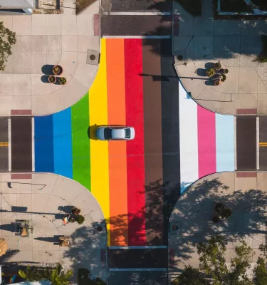 An aerial view of a colorful LGBTQ+ street mural at an intersection of the Grand Central District of Saint Pete.