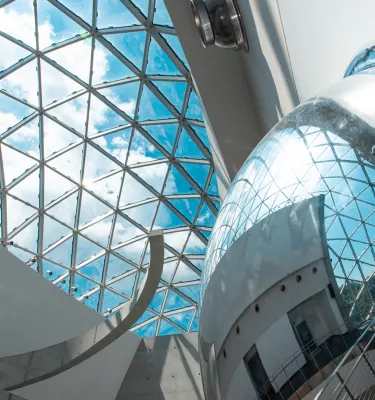 blue key and clouds seen through the curved windows of the "enigma" which is part of the Dali Museum in St. Pete Florida