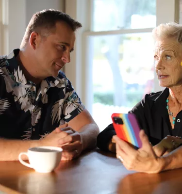Two actors looking at their phone