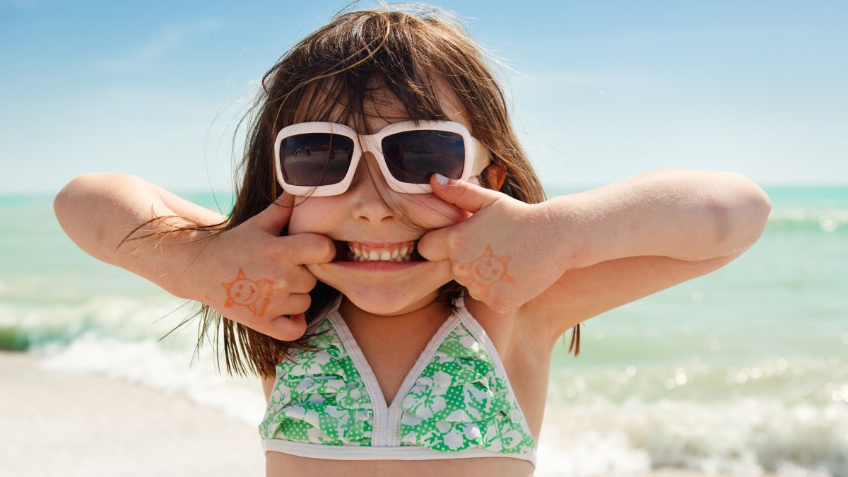 A girl making a funny smile on a beach in St. Pete/Clearwater