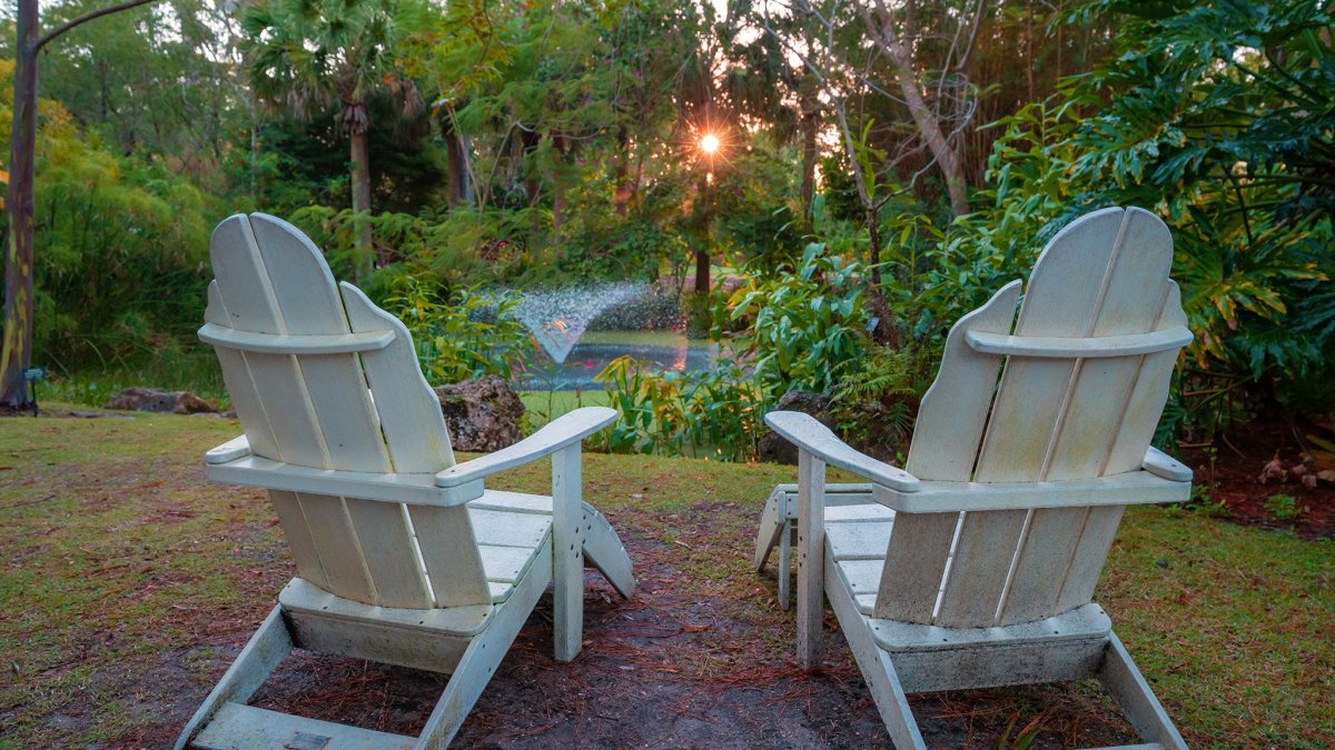 Adirondack chairs facing the fountain at Florida Botanical Gardens