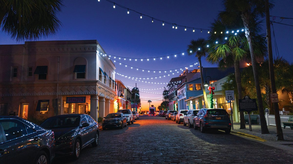 Pass-a-Grille's small downtown area is lit up at dusk