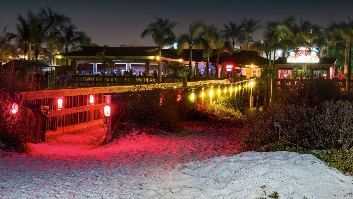 Exterior shot of Jimmy B's Beach Bar at night