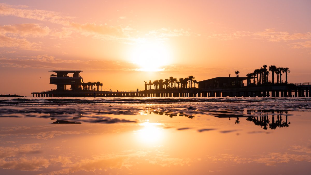 A pink and orange sunrise at St. Pete Pier