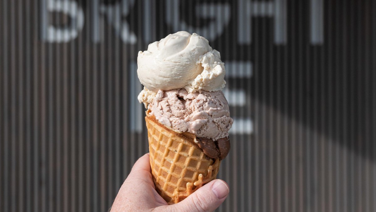 An ice cream cone in front of the Bright Ice Sign at their storefront in Pinellas Park