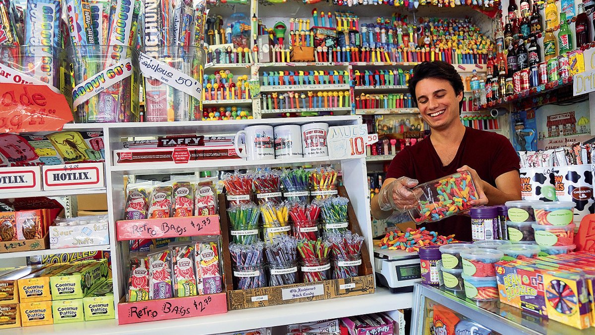 A employee behind a counter at the Candy Kitchen on Madeira Beach