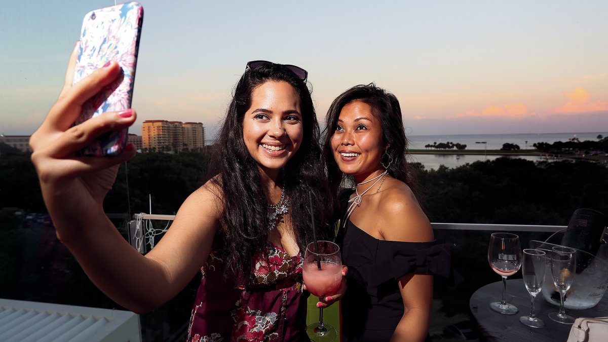 Two woman take a selfie at the Birchwood rooftop