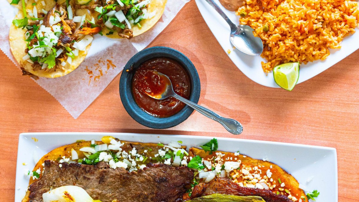 A close up shot of three plates of food from El Huarcache Veloz