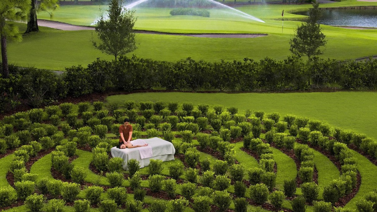 A woman receives an outdoor massage at the Salamander Spa at Innisbrook Golf & Spa Resort