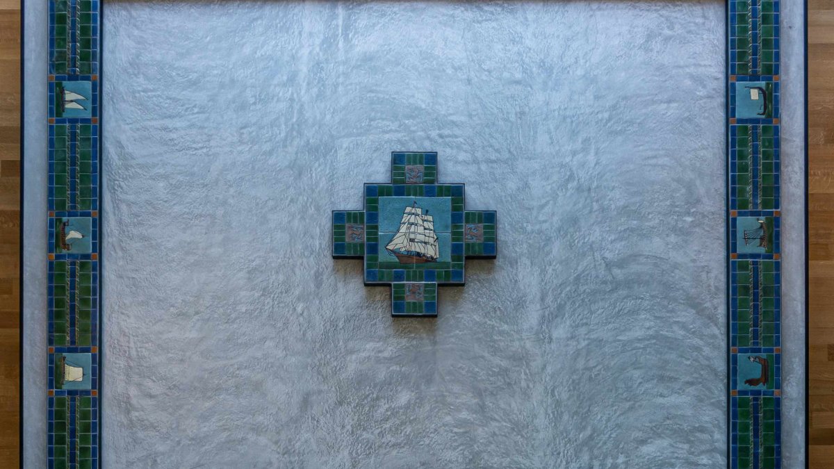 Handmade floor tiles From the turn of the 20th Century depicting a ship at sea.