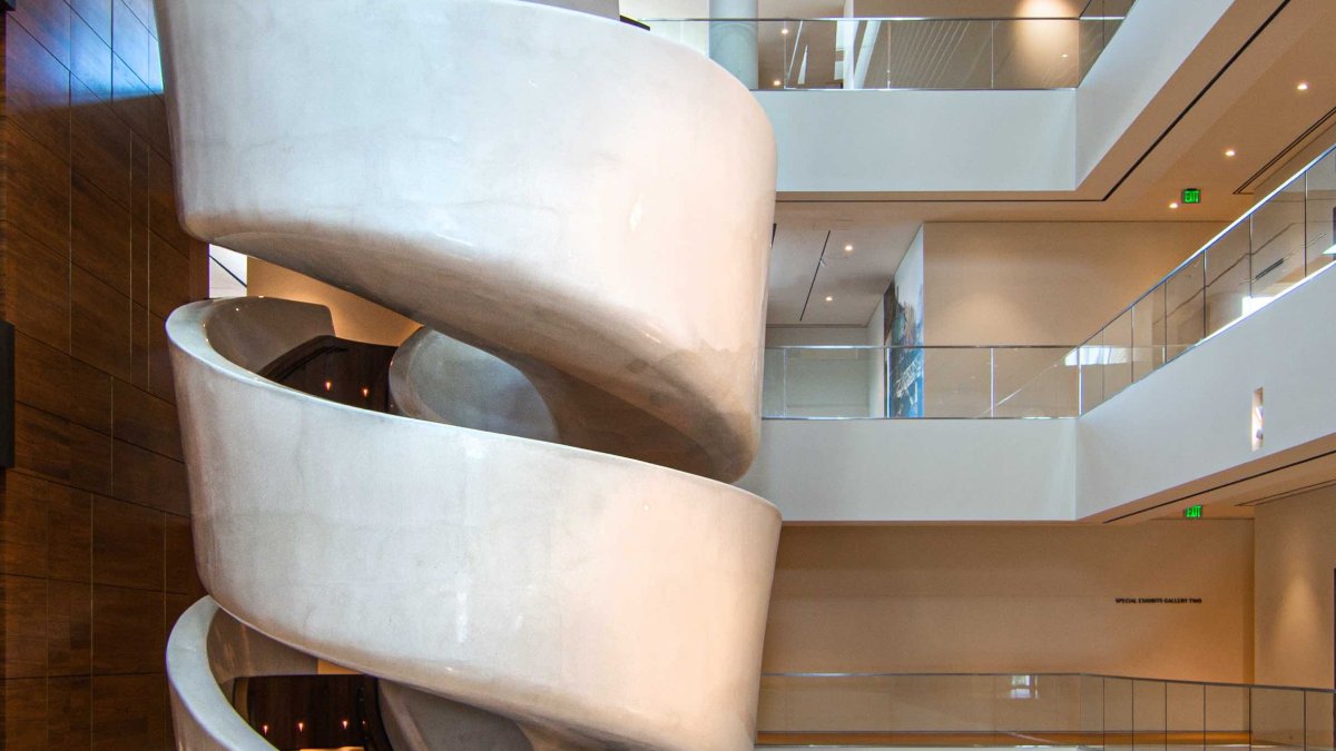 A tightly wound spiral staircase painted white on the exterior.