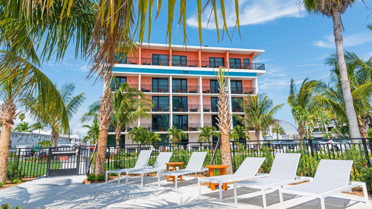 An outside shot of the Hilton Garden Inn Hotel in St. Pete Beach, with prominent pink and green features.