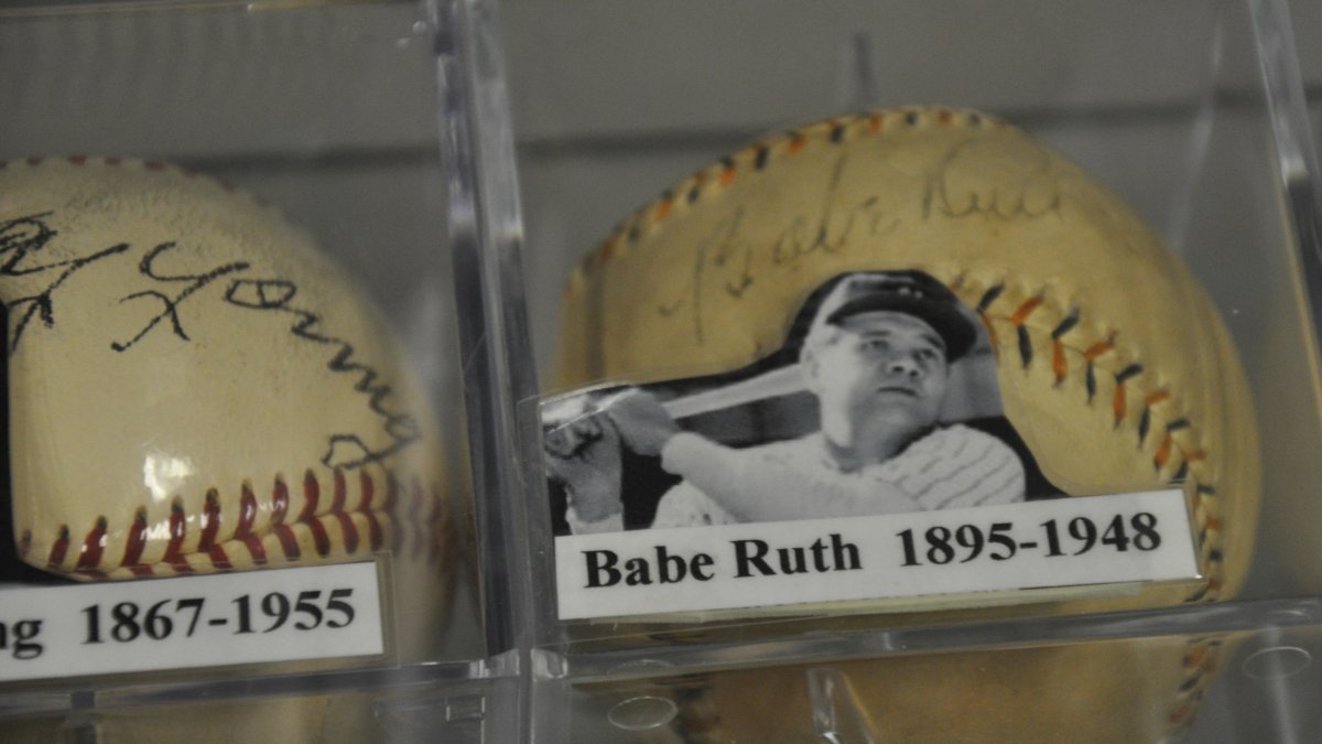 a glass case containing a baseball signed by Babe Ruth as well as his photo at the St. Petersburg Museum of History