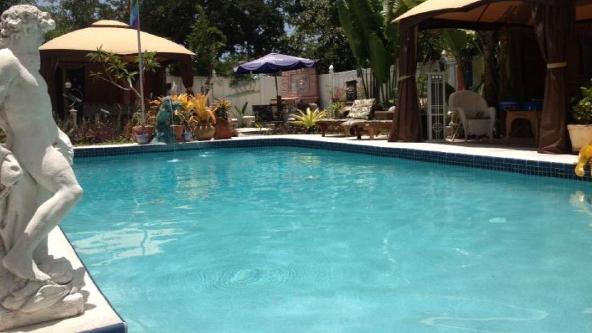 Pool and statue at GayStPete House B&B