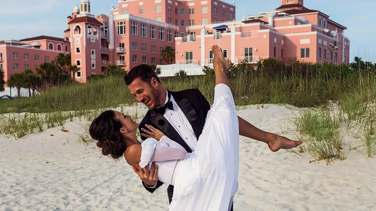 Couple on beach in front of Don Cesar
