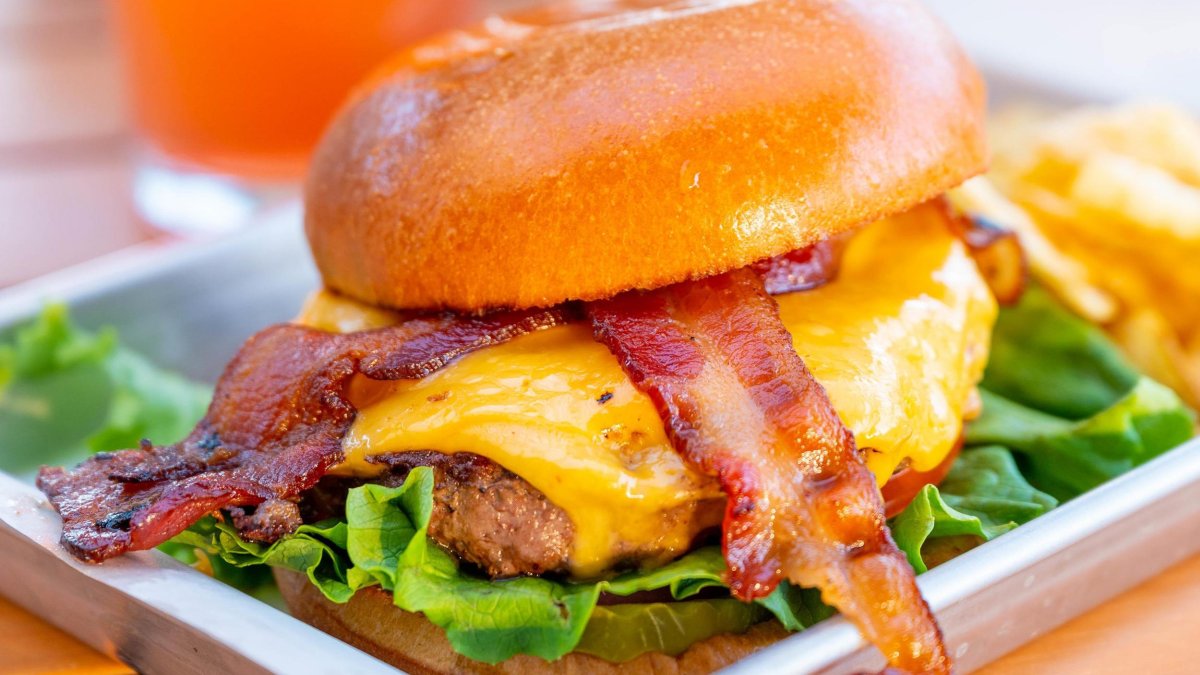 a bacon cheeseburger on a brioche bun at 3 Daughters Clearwater Beach