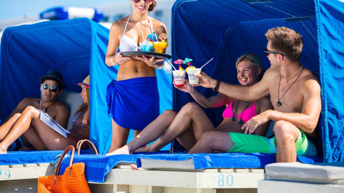 Perfect the art of doing nothing from you cushioned beach cabana