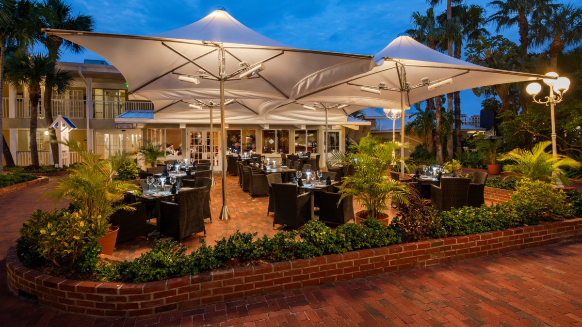 Dine under the stars on the terrace at Palm Court Italian Grill