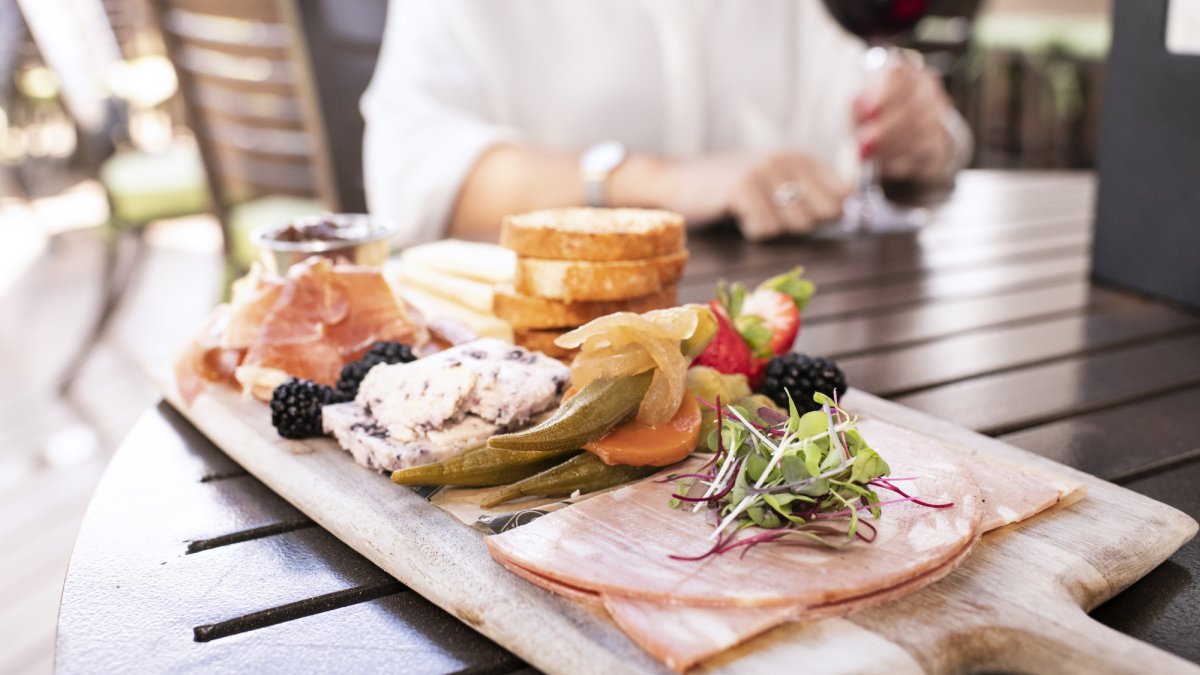 Enjoy the Daily Charcuterie and Cheese Board on the outdoor patio