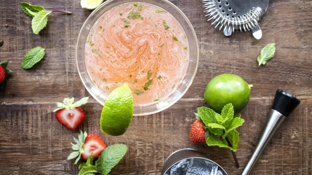 Strawberry Mojito Martini w/Coconut Rum & Vanilla Vodka w/pineapple, strawberries, fresh lime & mint