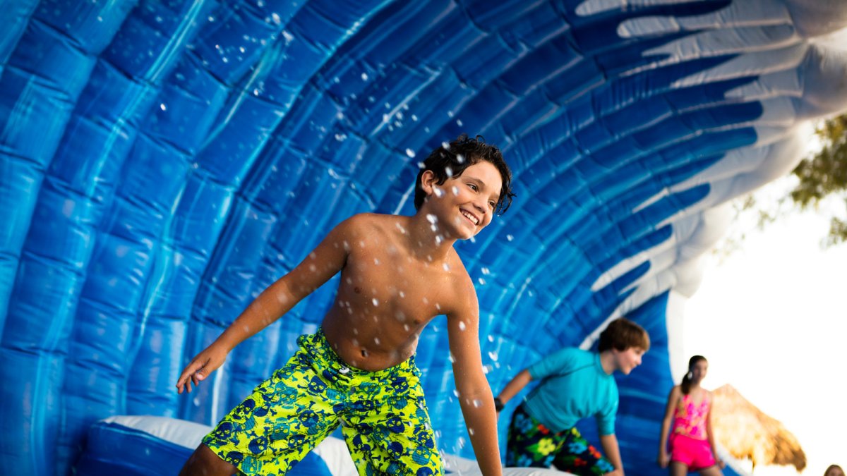 Test your balancing skills on the Surf WipeOut ride.