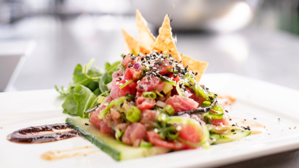 Tuna Poke with wakame salad, miso dressing, cucumber