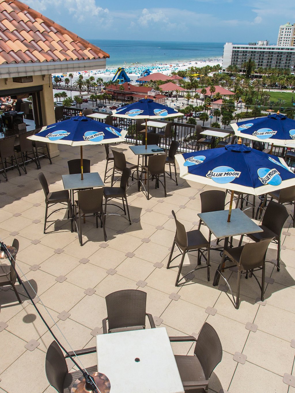 Overview of Jimmy Crow's Nest rooftop bar showing Clearwater Beach in the horizon