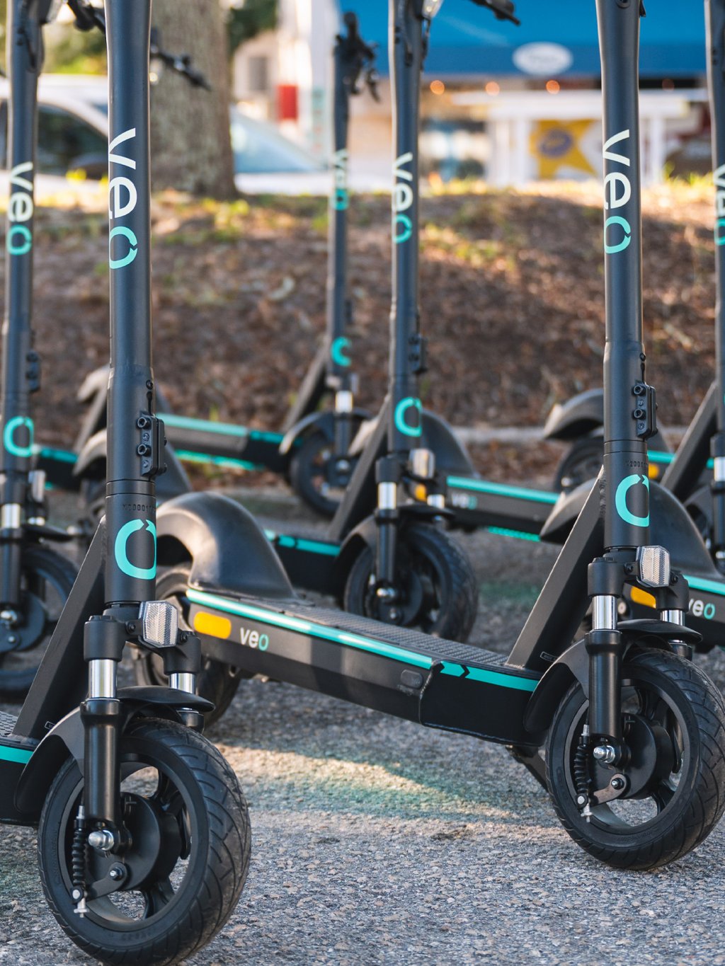 A close-up of black and turquoise electric scooters in St. Petersburg.